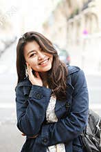 Asian pretty tourist standing in road background in Europe.