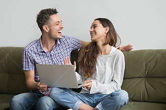 Couple laughing after watching funny video