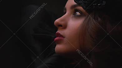 The actress wearily puts her head on her hands after the performance