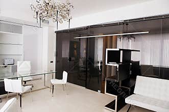 Meeting room of glass with leather furniture
