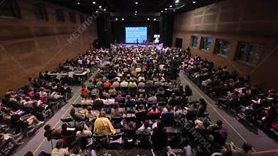 Brest, Belarus - MAY 9, 2018: Top view of hundreds of students in a big lecture room. They sit and listen to the teacher