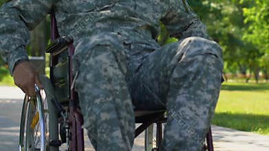 Soldier with disabilities on rehabilitation course in clinic for war veterans