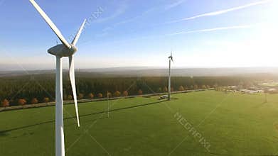 Wind turbine and agricultural fields on a summer day