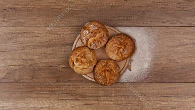 Bakery products and pasta made of wholemeal on rotating plates - top view