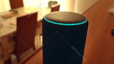 Barcelona, Spain. January 2019: Hand adjusting the Amazon Echo Plus smart Home device
