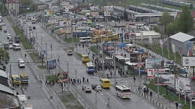 The areal shot of the busy city road next to the railway station