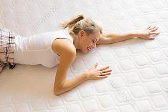 Woman enjoying her new comfortable mattress