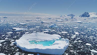 Antarctica melting blue water iceberg aerial view