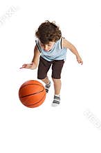 Adorable boy playing the basketball