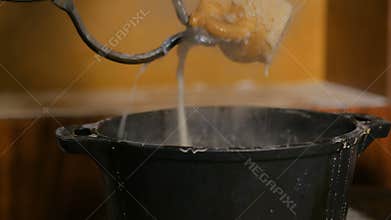 3 shots. Potter quenching hot ceramic mug