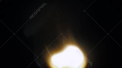 Fire of a wooden match in complete darkness, disappears from the flame on a black background, lighting and burning until