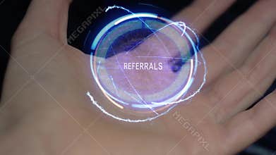 Referrals text hologram on a female hand
