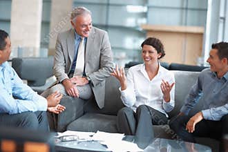 People enjoying a casual talk at the office lounge