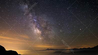 Milky way time lapse and stars rotating over the majestic Italian French Alps in summertime