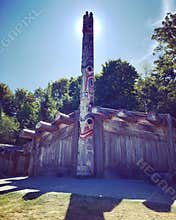 Haida Longhouse and Totem pole on display behind The Museum of Anthropology in Vancouver, British C