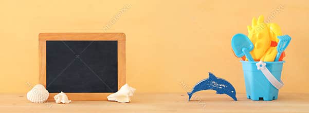 Vacation and summer banner with sea life style objects and beach toys for kid.