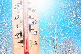 Cold winter weather - 10 degrees Celsius. Thermometer in winter frosty weather in the snow shows low temperatures - minus ten. Low