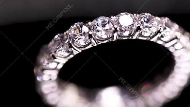 Diamond ring on black background