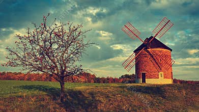 Beautiful old windmill. Landscape photo with architecture at sunset golden hour. Chvalkovice - Czech Republic - Europe.