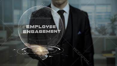 Profession tutor presenting Employee Engagement concept with hologram on his hand.