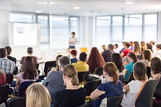 Speaker giving presentation on business conference.