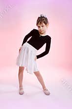 Little girl on pink background