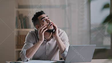 Nervous young hispanic arab businessman desperate accountant man adviser check financial documents debt bankruptcy feel