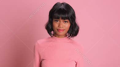 Disappointed sad woman has melancholic look at camera pursed lips being offended