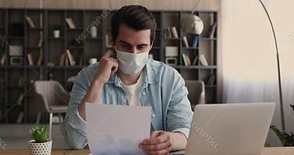 Employee in protective face mask hold document analyzing statistics data
