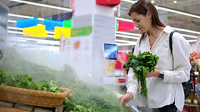 Buying fresh greens in the supermarket