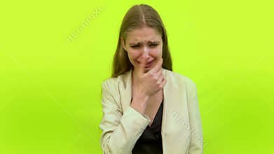 Woman having stomach ache and cramps crying in space studio