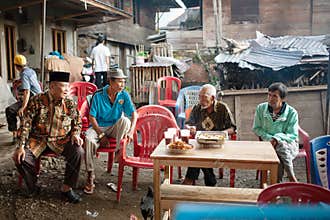 The elders are having breakfast and enjoying coffee