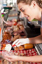 Butcher Packing Food for Customer
