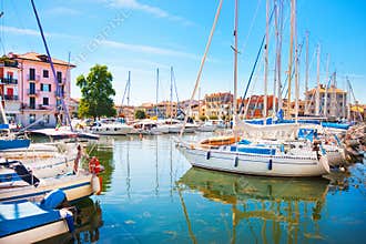 Mediterranean summer scene with boats in harbor