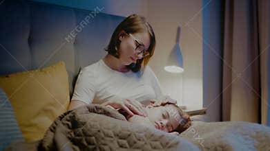 Mother take care of sleepy child