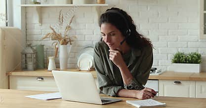 Happy young woman enjoying online video call educational class.