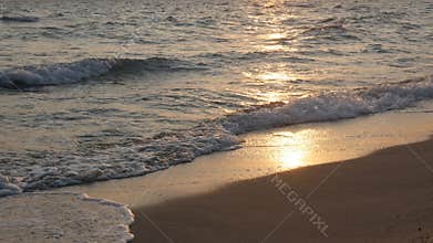 Aegean sea beach sand and waves before sunrise 4K video