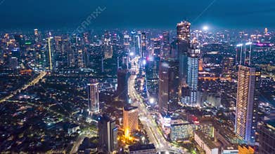 Stunning City View of Futuristic Skyline at Night, Skyscrapers in Asian Indonesian Capital Jakarta with flashing lights