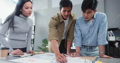 Asian business financial team work together in project brainstorm meeting. Cooperate teamwork, strategy planning