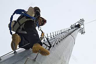 Climber resting in the middle of the climb
