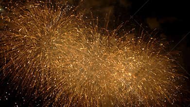 4K, Beautiful colorful fireworks light up the sky, dark background. New Year