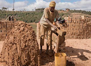 Africa: man making bricks from clay, by hand in Madagascar