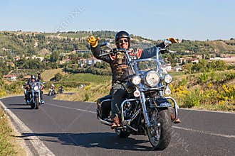 Happy driver riding Harley Davidson