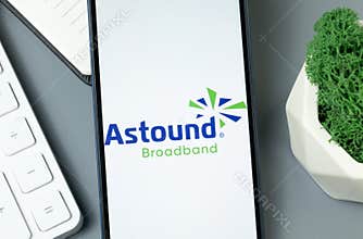 New York, USA - 30 August 2024: Astound Broadband Logo on Phone Screen, Company Icon on Display