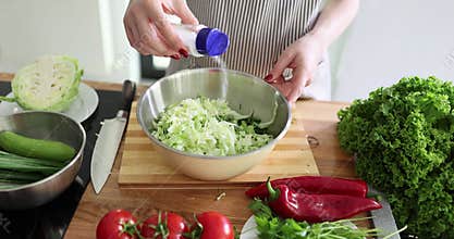 Delicious healthy salad of fresh vegetables with added salt
