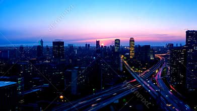 Generic Cityscape Timelapse from Sunset to Night with Skyscrapers and Highway Traffic