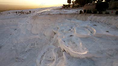Aerial view of the travertines in Pamukkale in a beautiful sunset, Turkey. White limestone mineral formations. Turkish