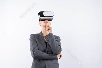 Smart businesswoman thinking about plan while wearing VR glasses. Contraption.