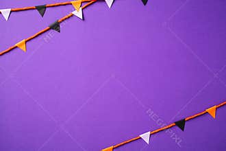 Halloween bunting flag garland on purple background. Happy Halloween greeting card design