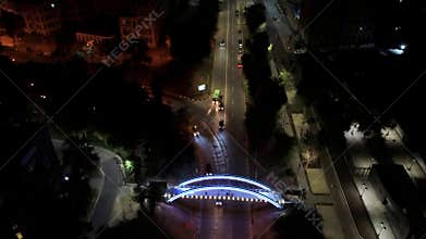 Aerial night illuminated bridge look down
